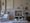 Salon avec mur greige flamand, canapé blanc, tableau abstrait et objets décoratifs naturels — peinture L'Air de Rien Bilboquet Deco