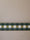 Frise Cadence Vert installée en bandeau mural, damier vert sapin, vert olive et blanc — Bilboquet Déco